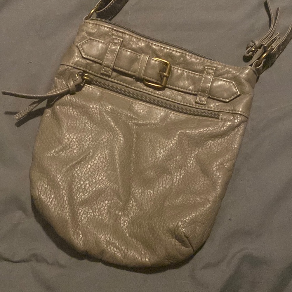 Grey crossbody purse. 6x6 inch square with buckle detailing.